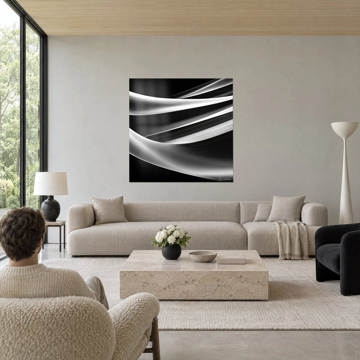 Wall art with silver silk ribbons rippling on a black background, fine pearl-grey lines, above a sofa in a bright living room