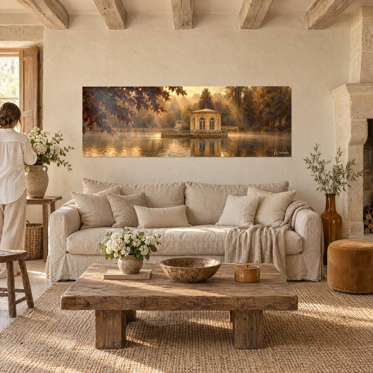 Gemälde Oktogonaler Pavillon in Ockertönen auf seiner Insel, goldener Dunst und braunes Laub, über einem Sofa in einem hellen Wohnzimmer