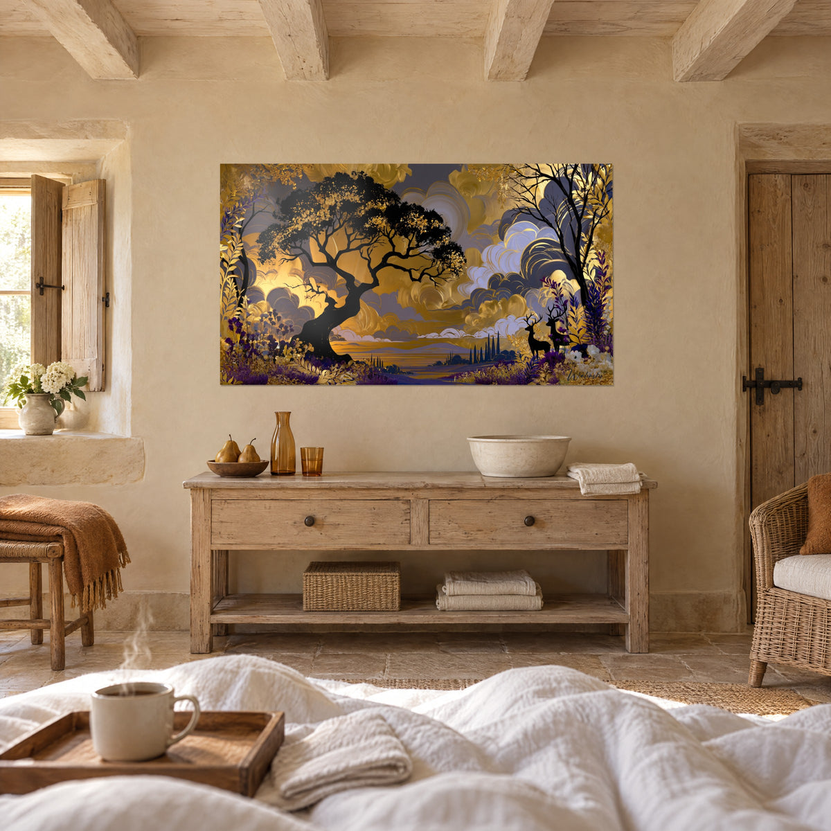 Wall art of a golden forest with a large black tree, swirls of grey-blue and ochre clouds, backlit deer, above a bed in a bright bedroom