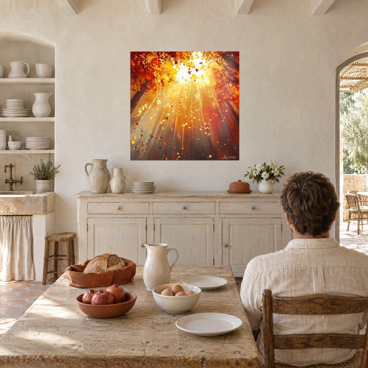 Wall art slender trunks bathed in golden light, ochre and vermilion falling leaves, cream wall, wooden table, Provençal farmhouse