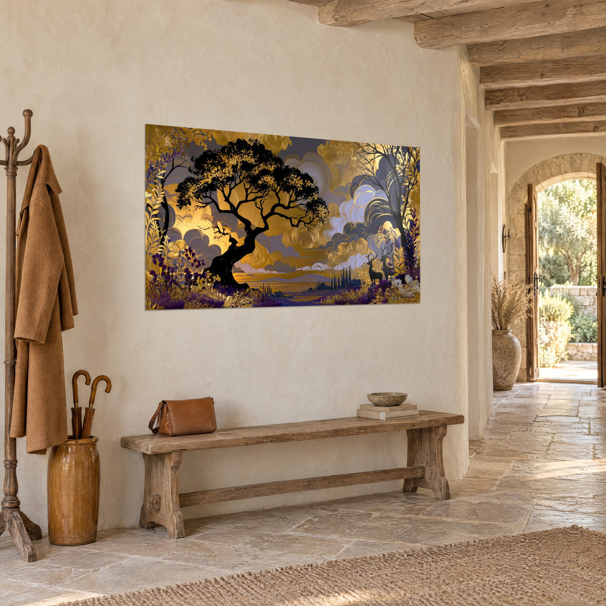 Wall art of a twisted jet-black tree over ochre and lavender clouds, golden foliage, hung in an entrance with pale stone