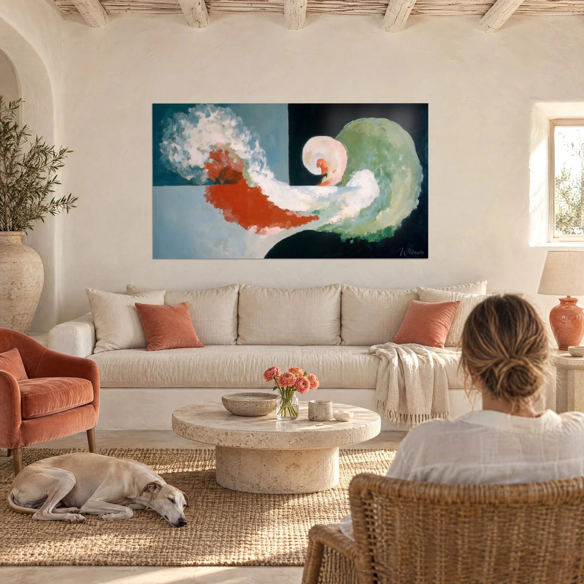 Wall art abstract spiral in vermilion red and sage green, white foam on black background, above a sofa in a bright living room