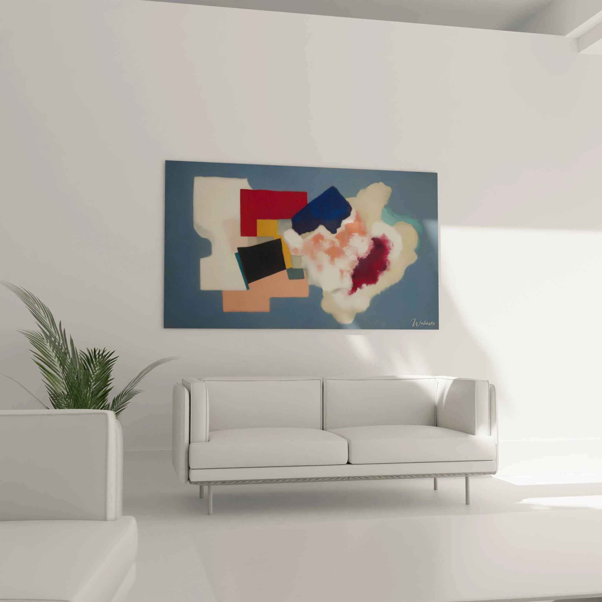 tableau formes géométriques moderne Walensky sur fond bleu accroché au dessus du canapé blanc dans salon minimaliste