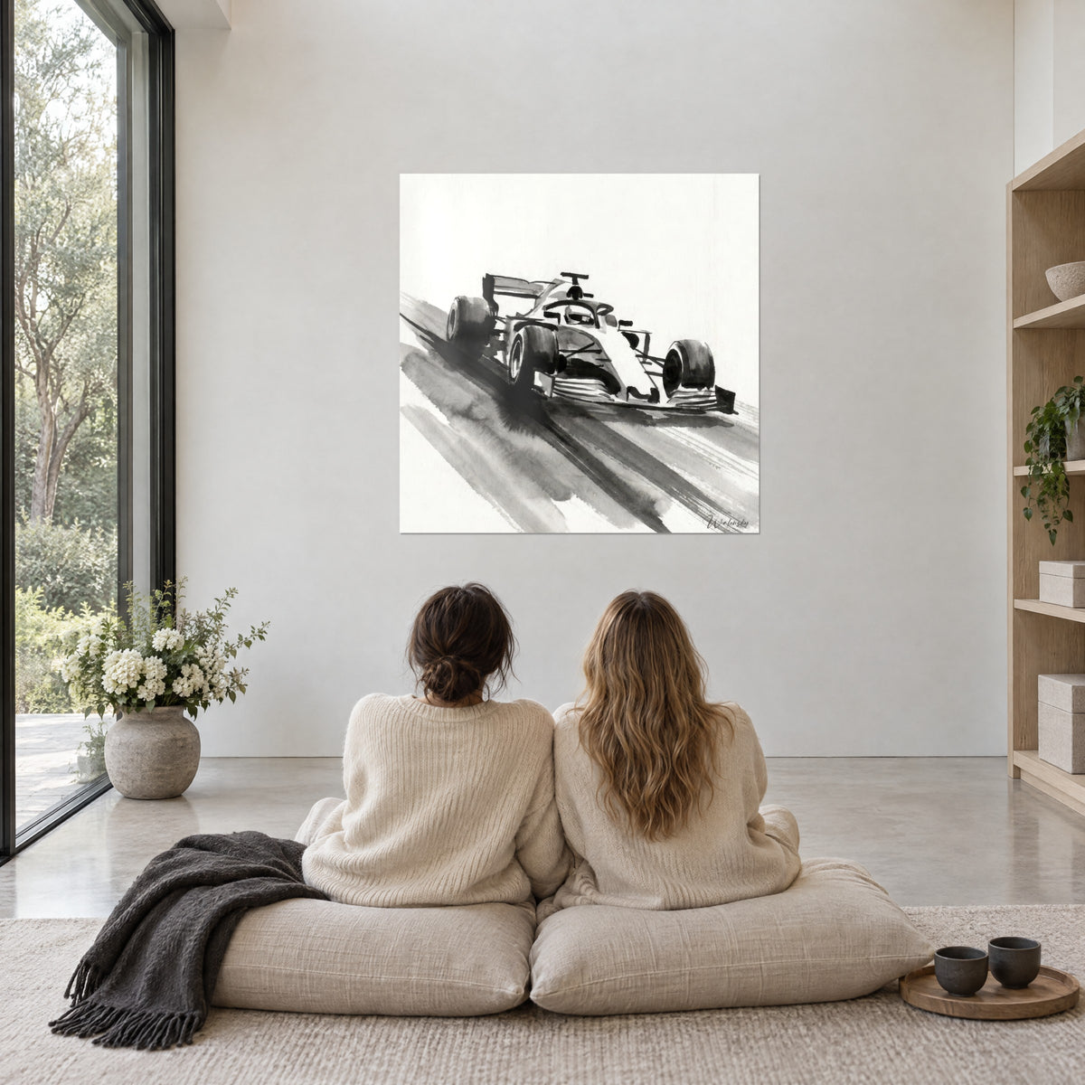 Wall art of a single-seater on an ink asphalt track, Chinese black and soft grey on ivory paper, two women seen from behind seated on cushions
