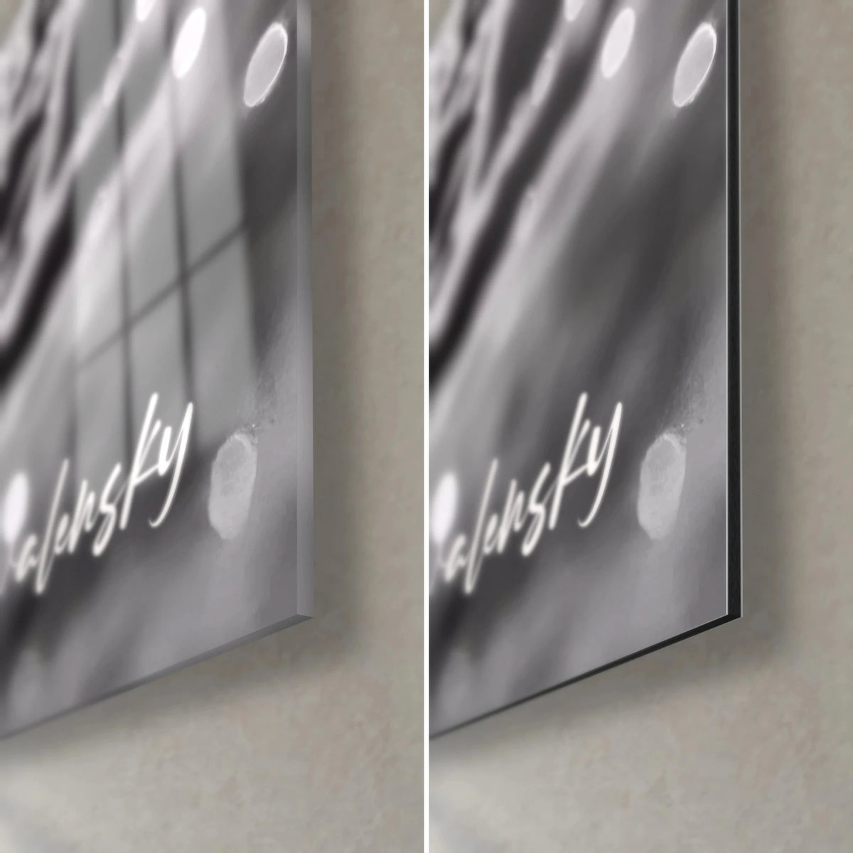 Wall art of a black and white skier, bottom right corner: white signature, glossy glass on the left, matte grey Dibond on the right