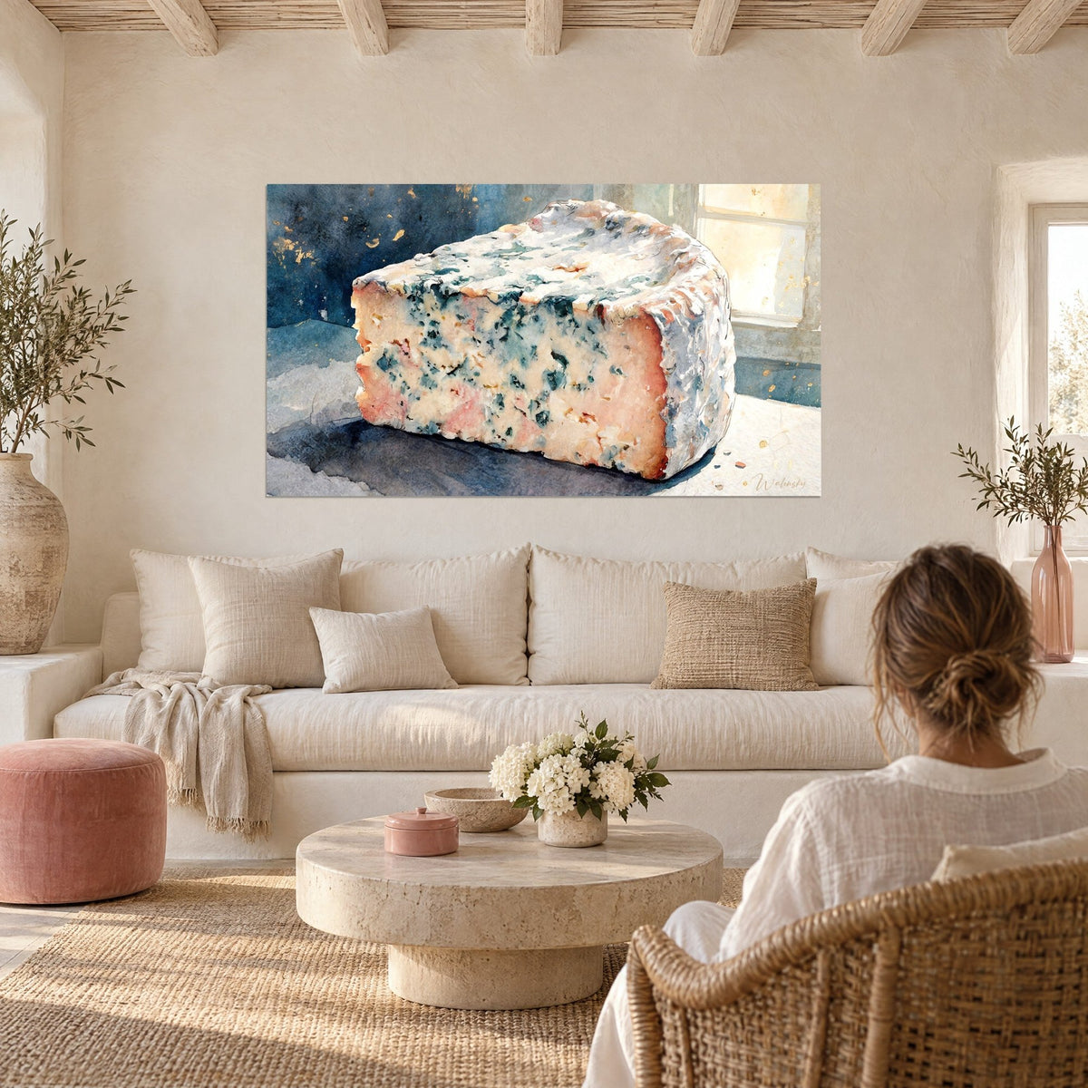 Wall art of a block of blue cheese with turquoise marbling, pink rind and golden window, above a sofa in a bright living room