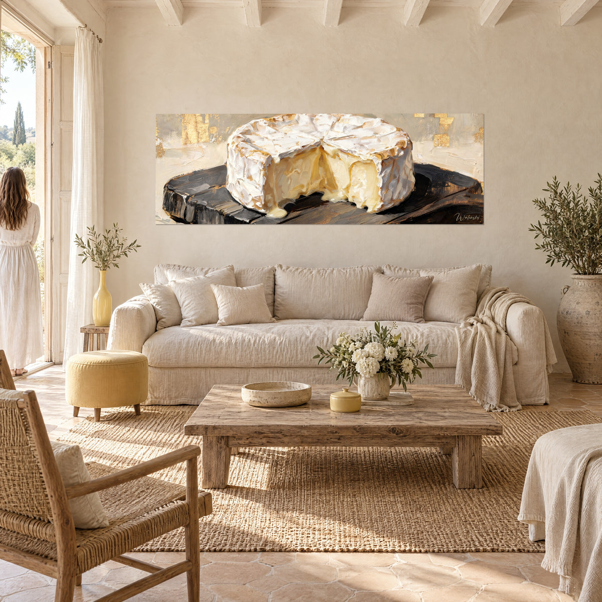 Wall art cut camembert with ivory rind, creamy core flowing onto a black board, above a sofa in a bright living room
