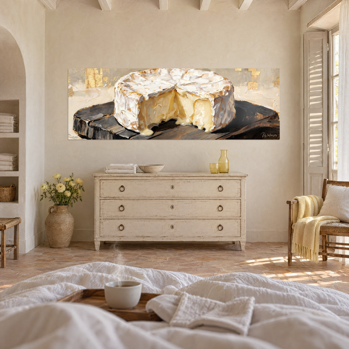 Wall art cheese with butter-yellow creamy paste and white rind, black board, above a bed in a light bedroom