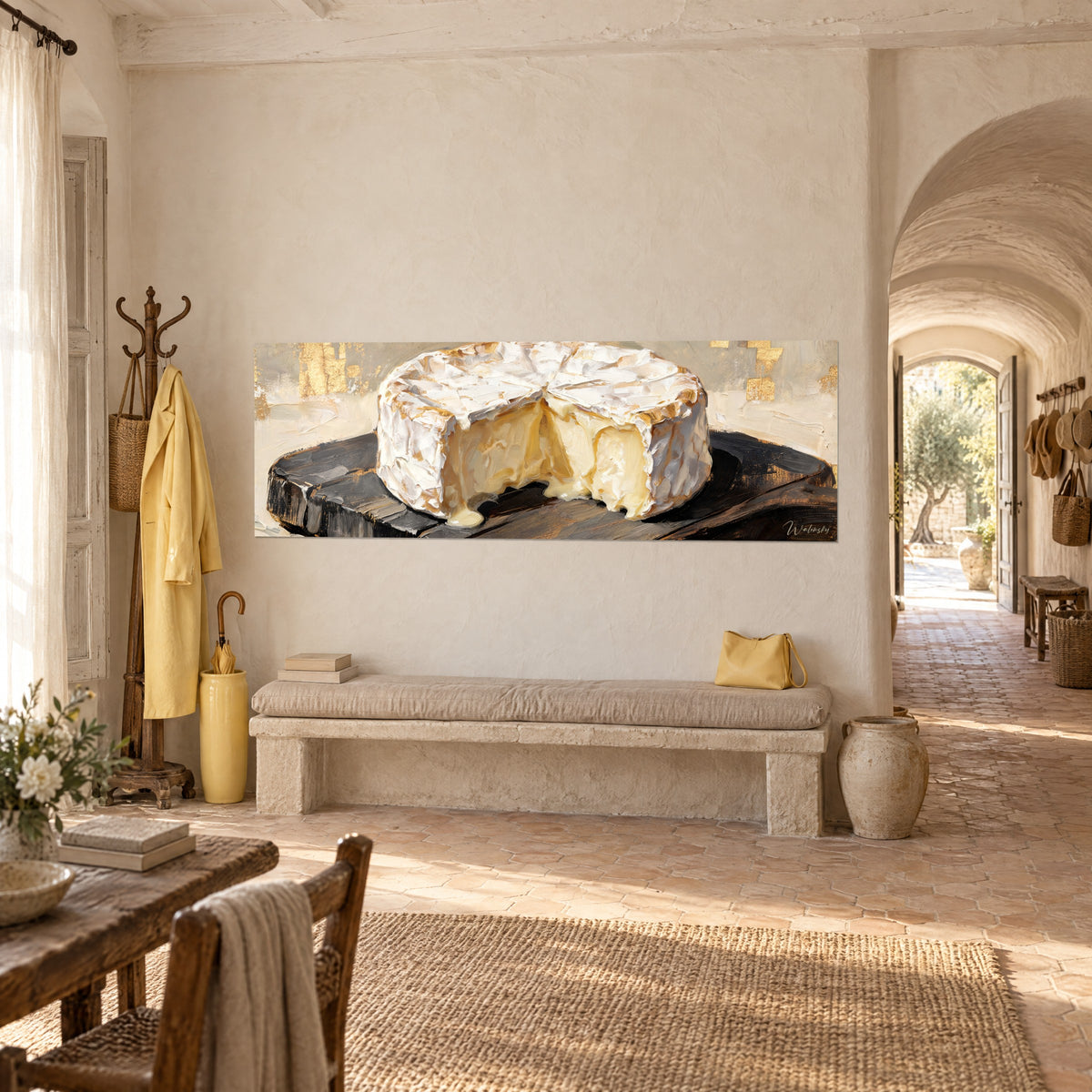 Wall art round cheese with white and golden rind, dark brown cracked board, hung on the wall of a Provençal farmhouse