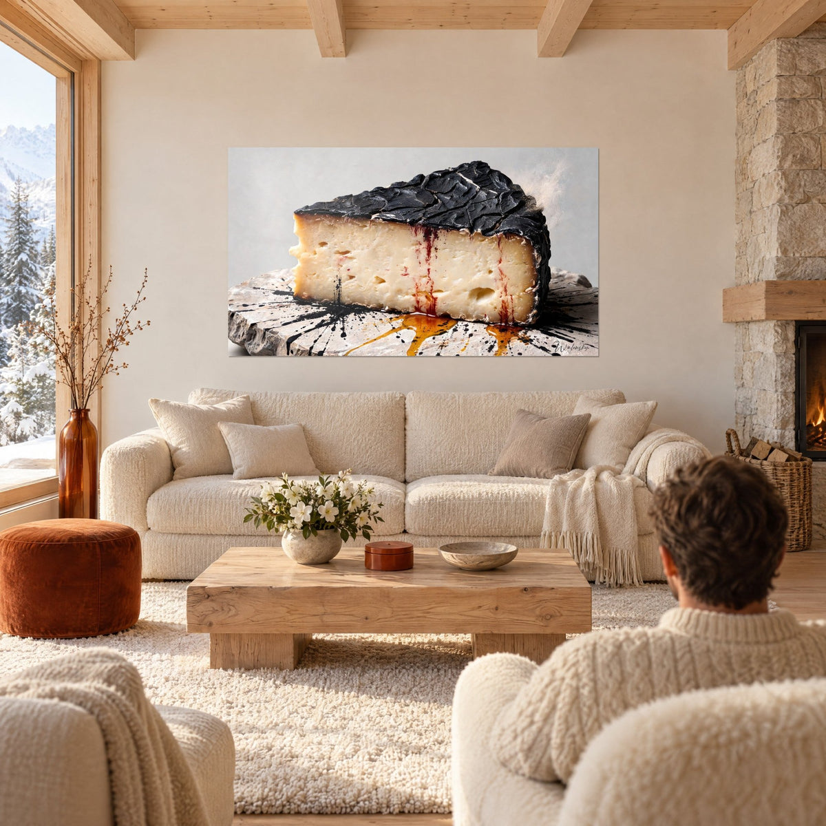 Tableau part de fromage à croûte noire craquelée et pâte ivoire, filets rouges, au-dessus d'un canapé dans un salon lumineux