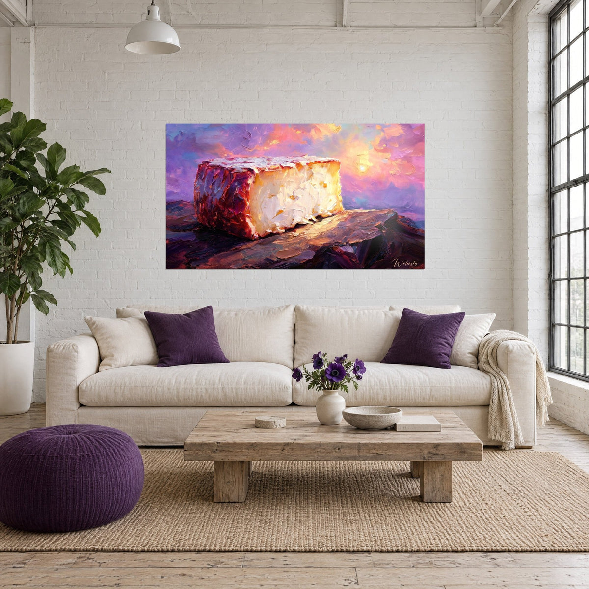 Tableau fromage crémeux à croûte lavée, rouge brique et ivoire, ciel mauve et rose, au-dessus d'un canapé dans un salon lumineux