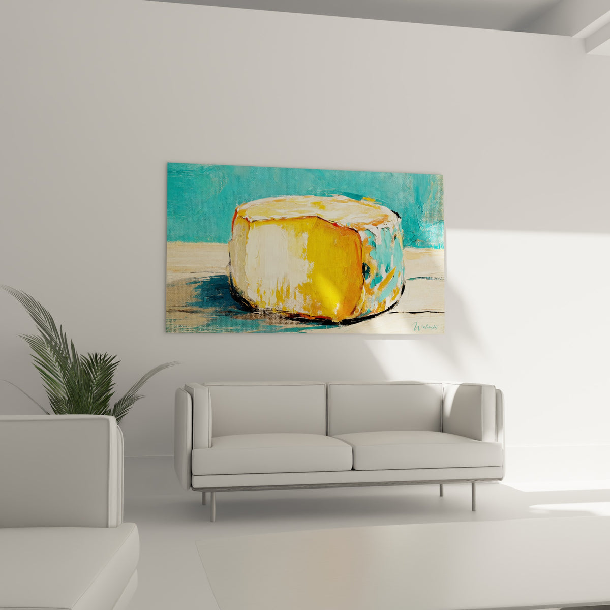 Meule dorée aux reflets turquoise, tableau accroché au-dessus d'un canapé dans un salon lumineux.