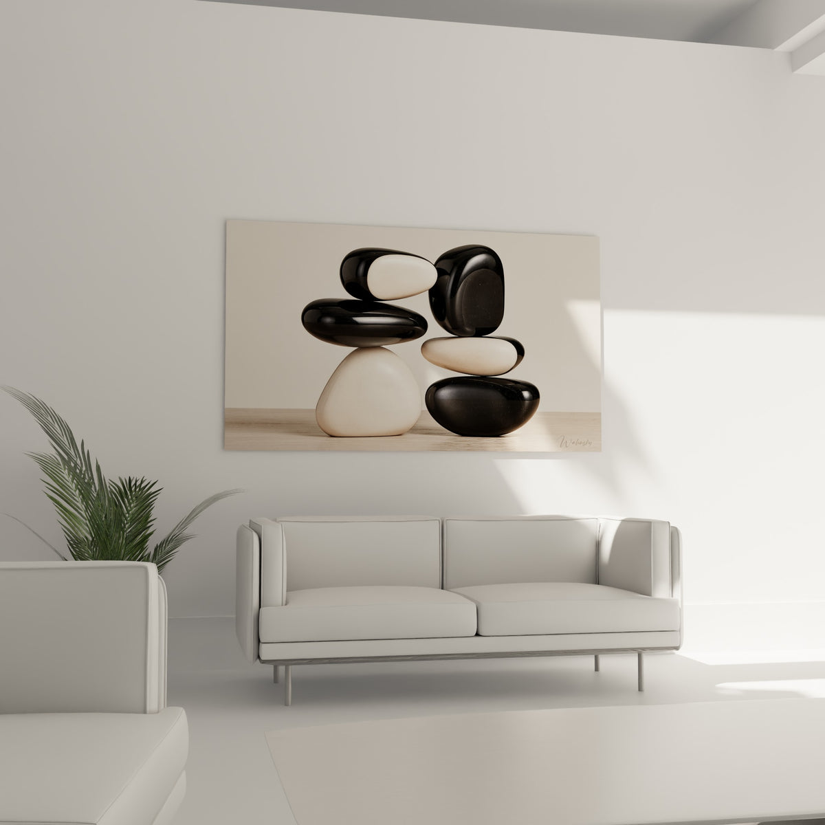 Pierres noires et blanches en équilibre, reflets satinés, au-dessus d'un canapé dans un salon lumineux