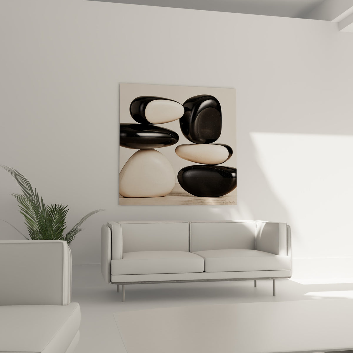 Pierres polies noir et beige en équilibre au-dessus d'un canapé dans un salon lumineux
