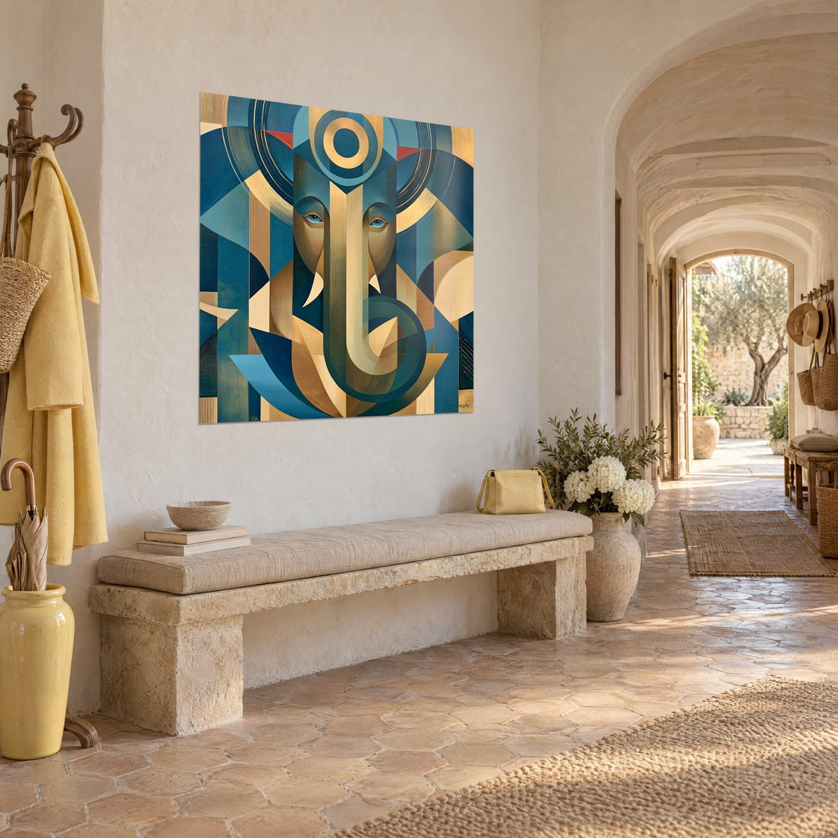 Wall art deity with curled golden trunk, concentric discs and ochre facets on duck blue, at the end of the vaulted hallway of the farmhouse