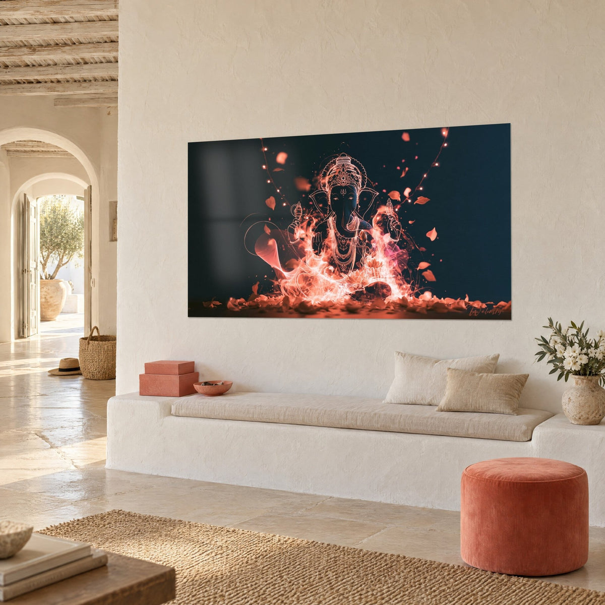 Wall art elephant-headed deity surrounded by coral and pink flames, navy background, string lights, on a cream wall facing a white bench seat