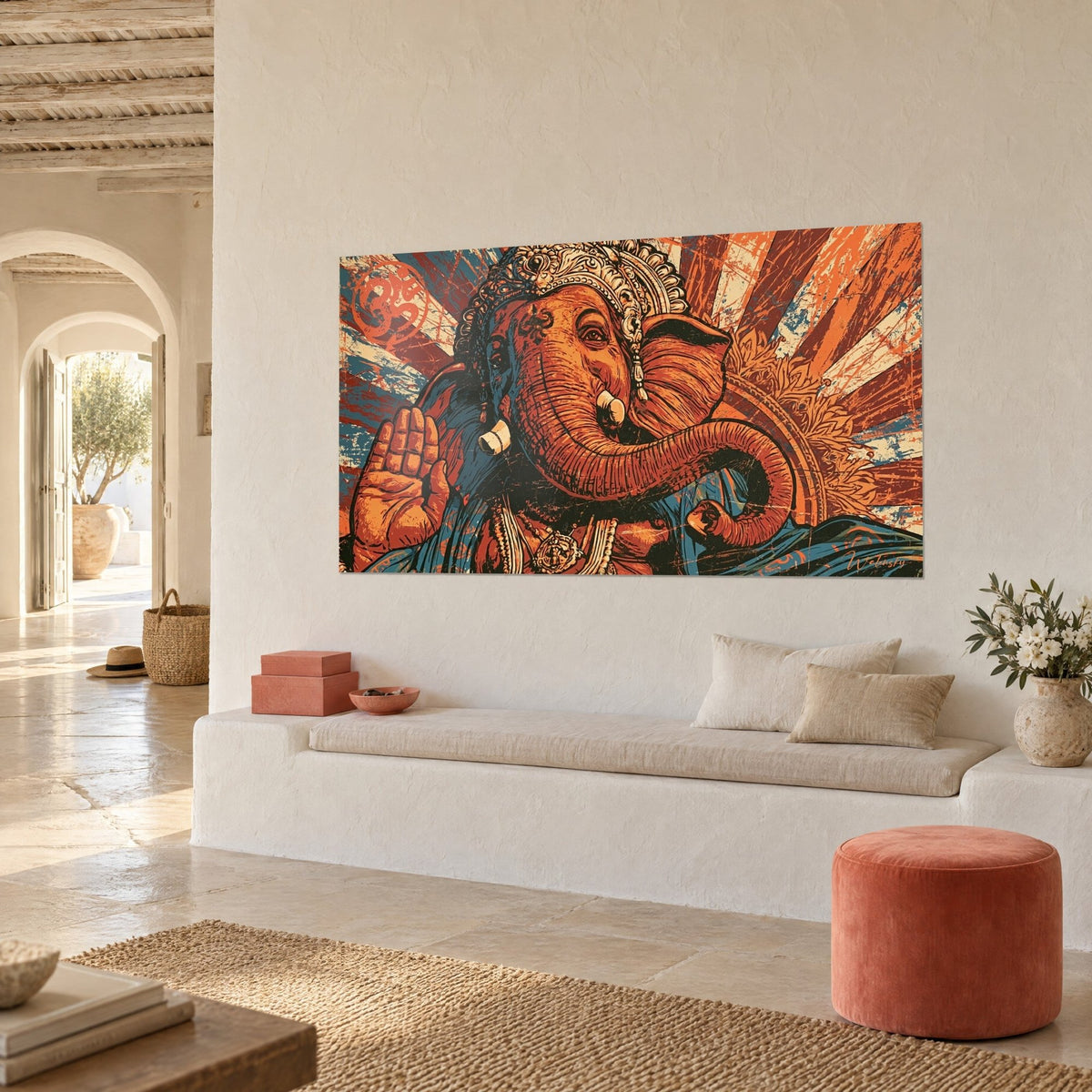 Wall art of Ganesh adorned with a silver diadem, curled orange trunk, glowing blue and red background, white masonry bench