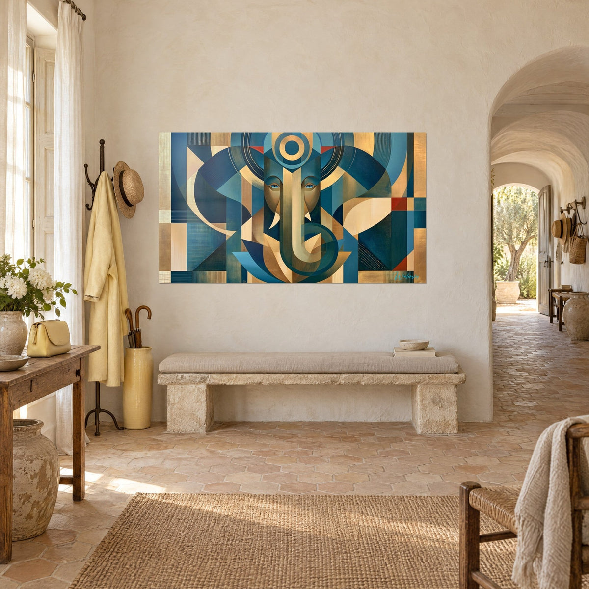 Wall art deity with trunk in geometric shapes of petrol blue and matte gold, concentric circles, on the wall of a Provençal farmhouse