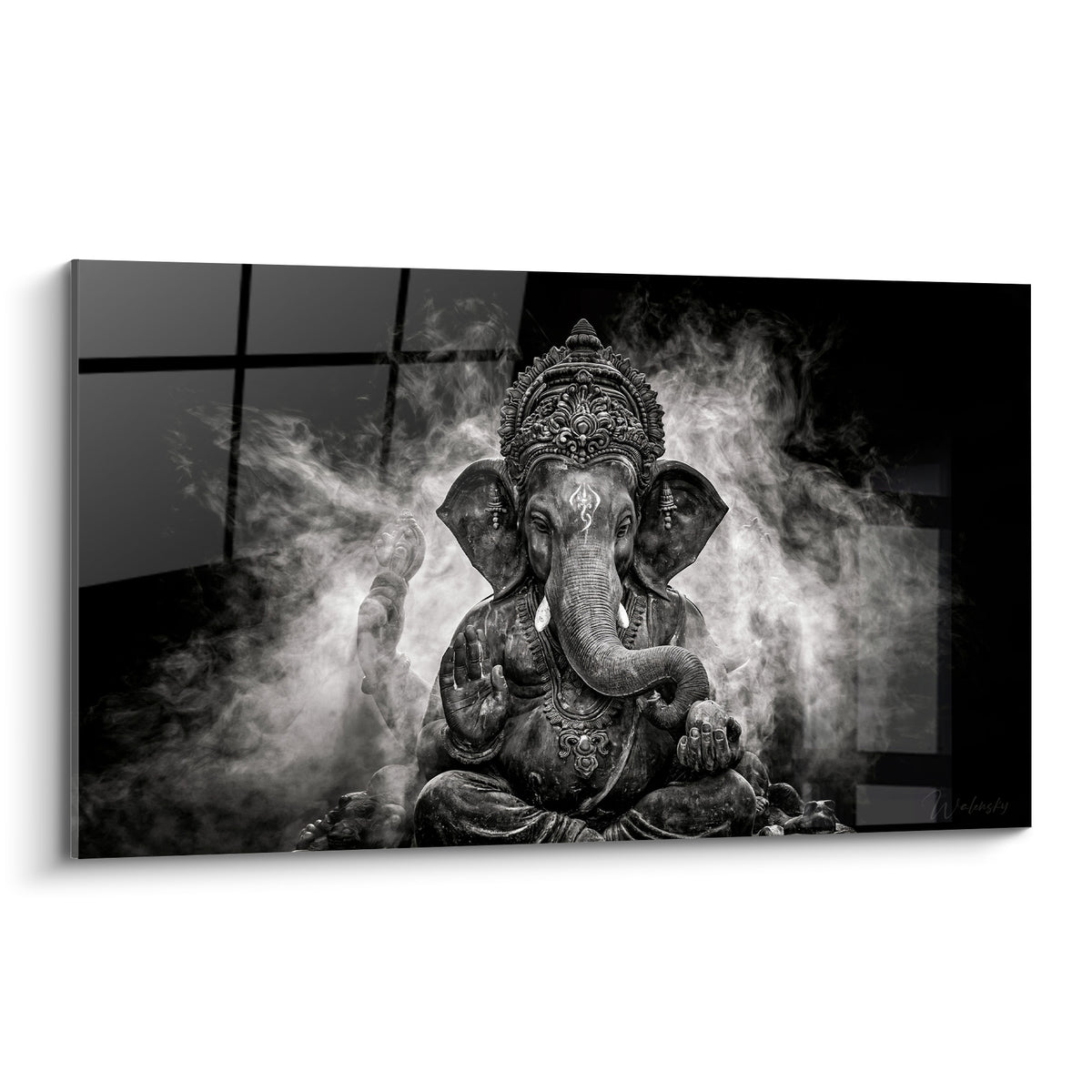 Wall art of Ganesh carved in anthracite grey, raised hands, wrapped in dense white smoke