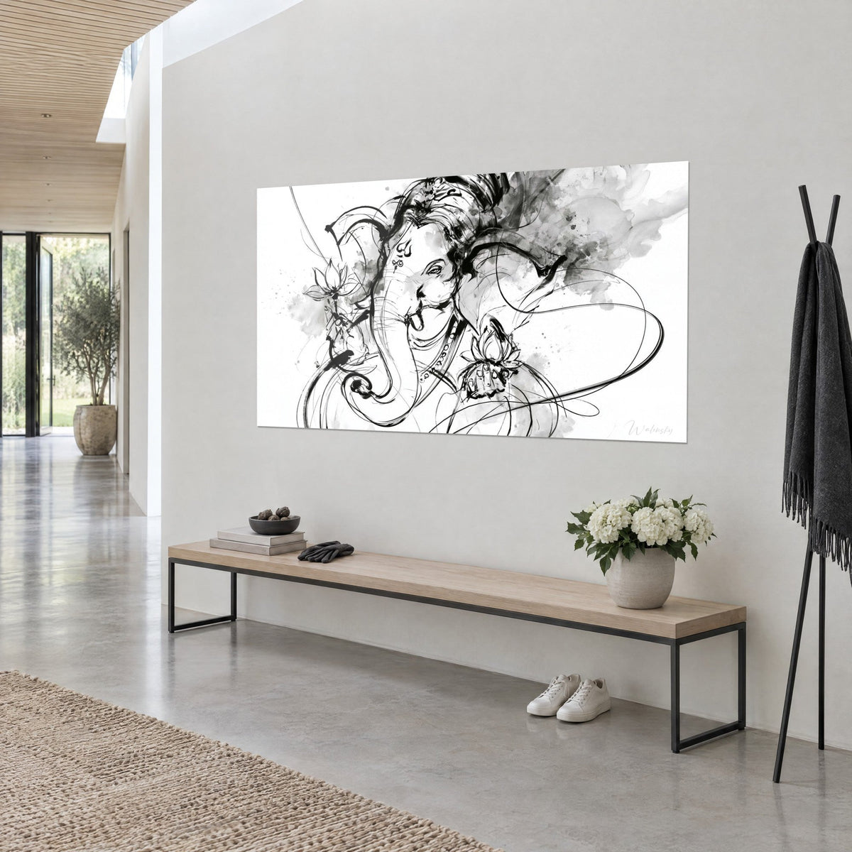Wall art elephant-headed deity in black ink strokes on white background, grey wash, oak bench, architect-designed house