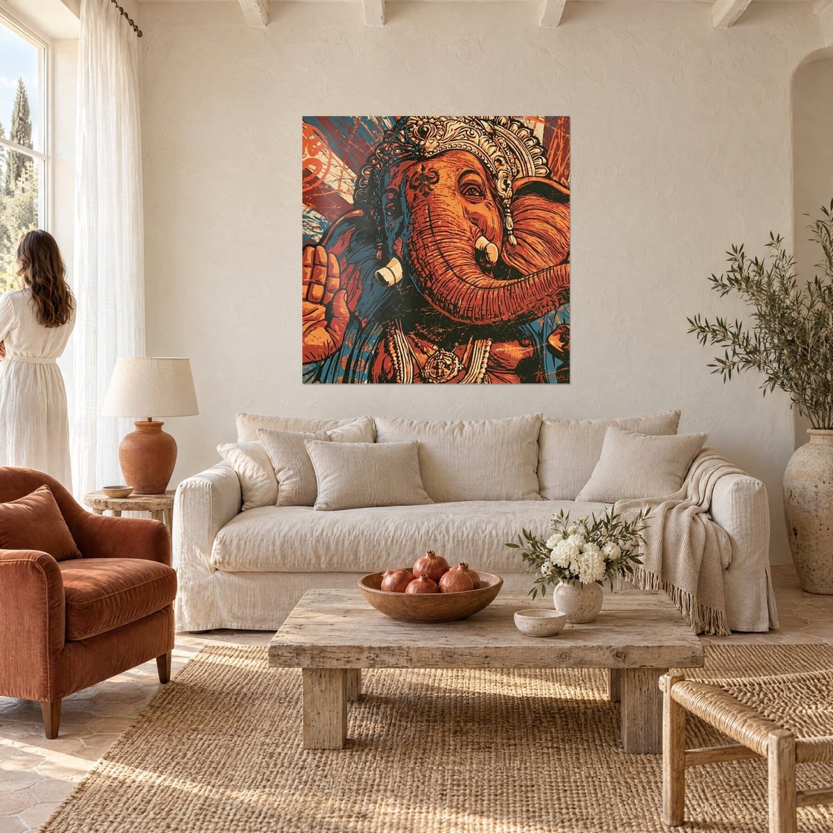 Wall art Ganesh with curled trunk, burnt orange and petrol blue, chiselled crown, above a sofa in a bright living room