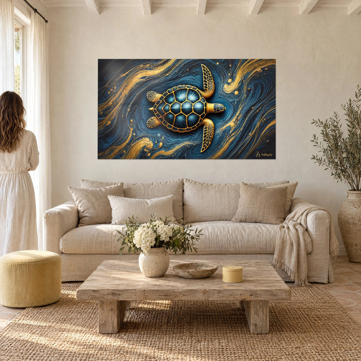 Wall art sea turtle edged in gold on a midnight blue swirl, shell with frosted stars, above a sofa in a bright living room