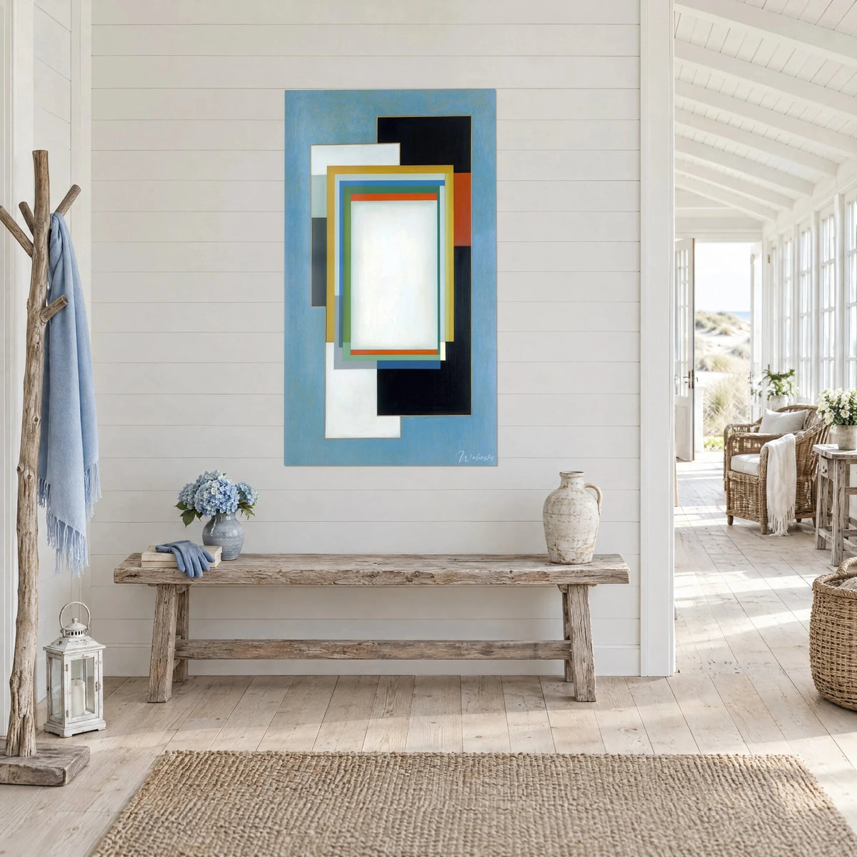 Tableau composition constructiviste de rectangles noirs et blancs, liserés orange et ocre, dans une maison de bord de mer