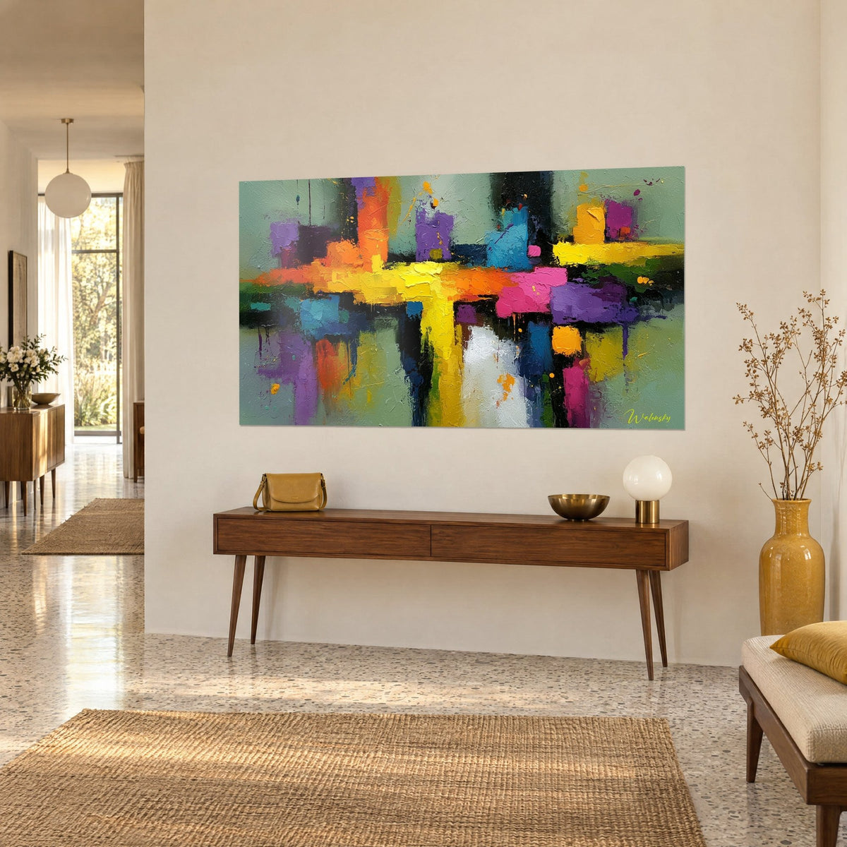 Wall art with an abstract composition of a lemon yellow, fuchsia pink and turquoise blue cross, hung above a wooden console