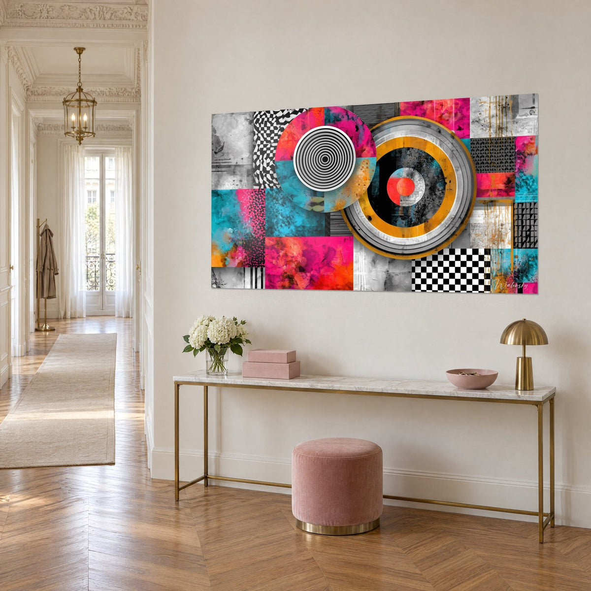 Wall art with an ochre circle outlined in silvery grey, coral red heart, fuchsia and cyan color blocks, three-quarter view of a console table