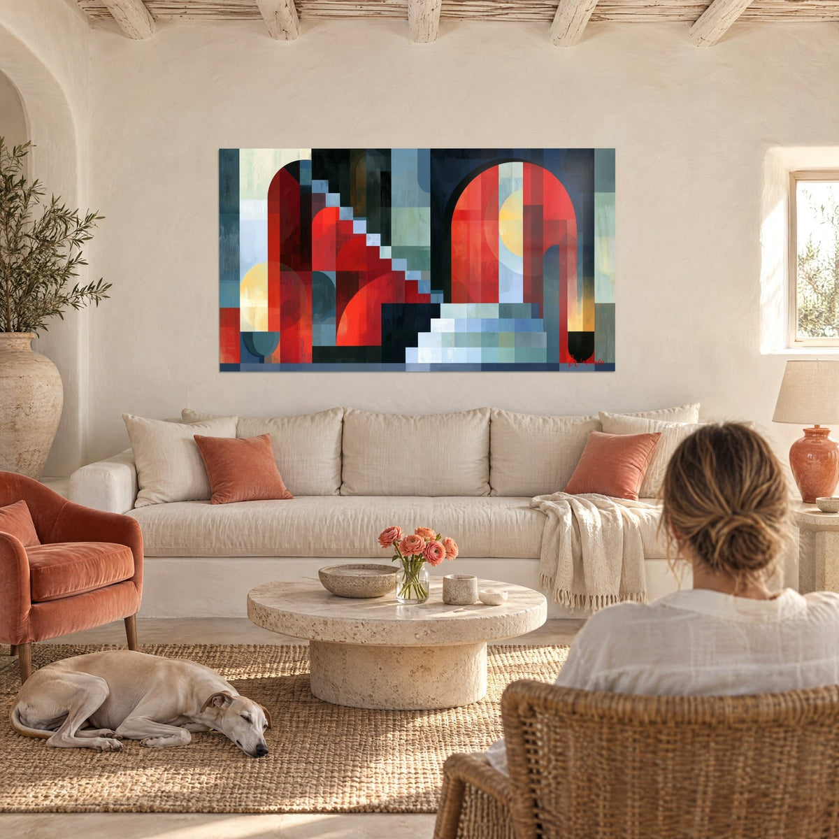 Wall art with red arches and navy blue staircase, pale yellow sun, woman and greyhound above a sofa in a bright living room