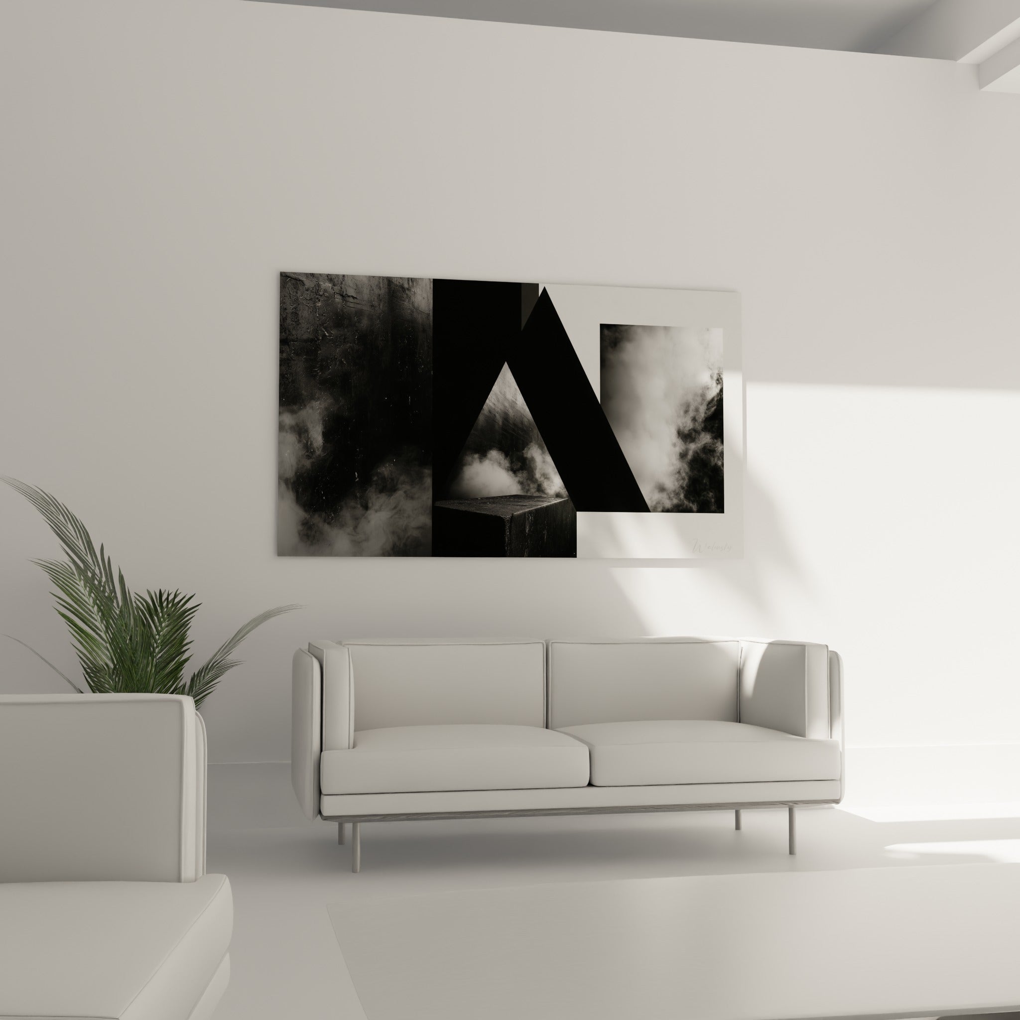 Formes triangulaires noires et grises animent ce tableau géométrique abstrait au-dessus d'un canapé dans un salon lumineux