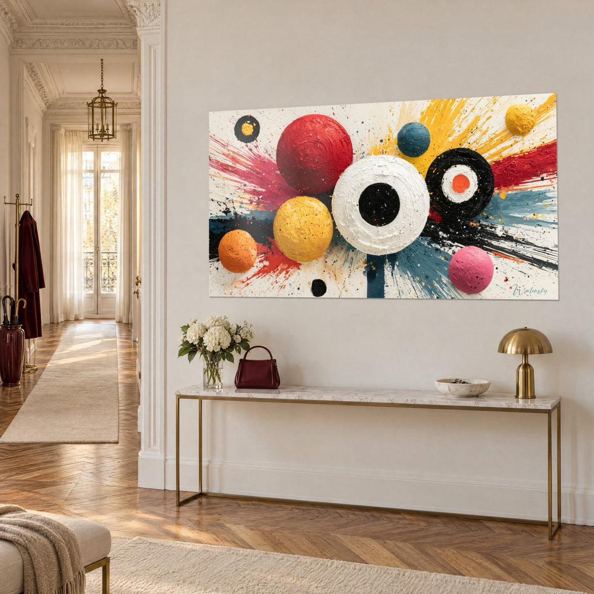 Wall art with thickly painted circles, a white ring with a black heart surrounded by mustard yellow, on a gold console table, three-quarter view
