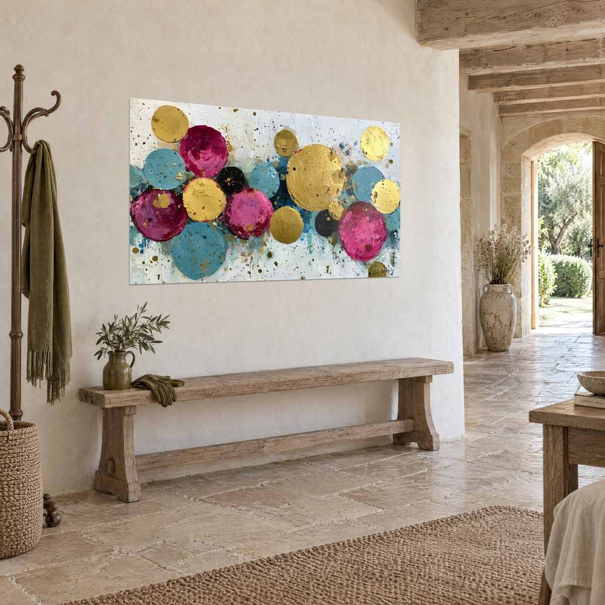 Wall art with turquoise and fuchsia paint bubbles, gold and black accents on a cream background, stone wall of a country house