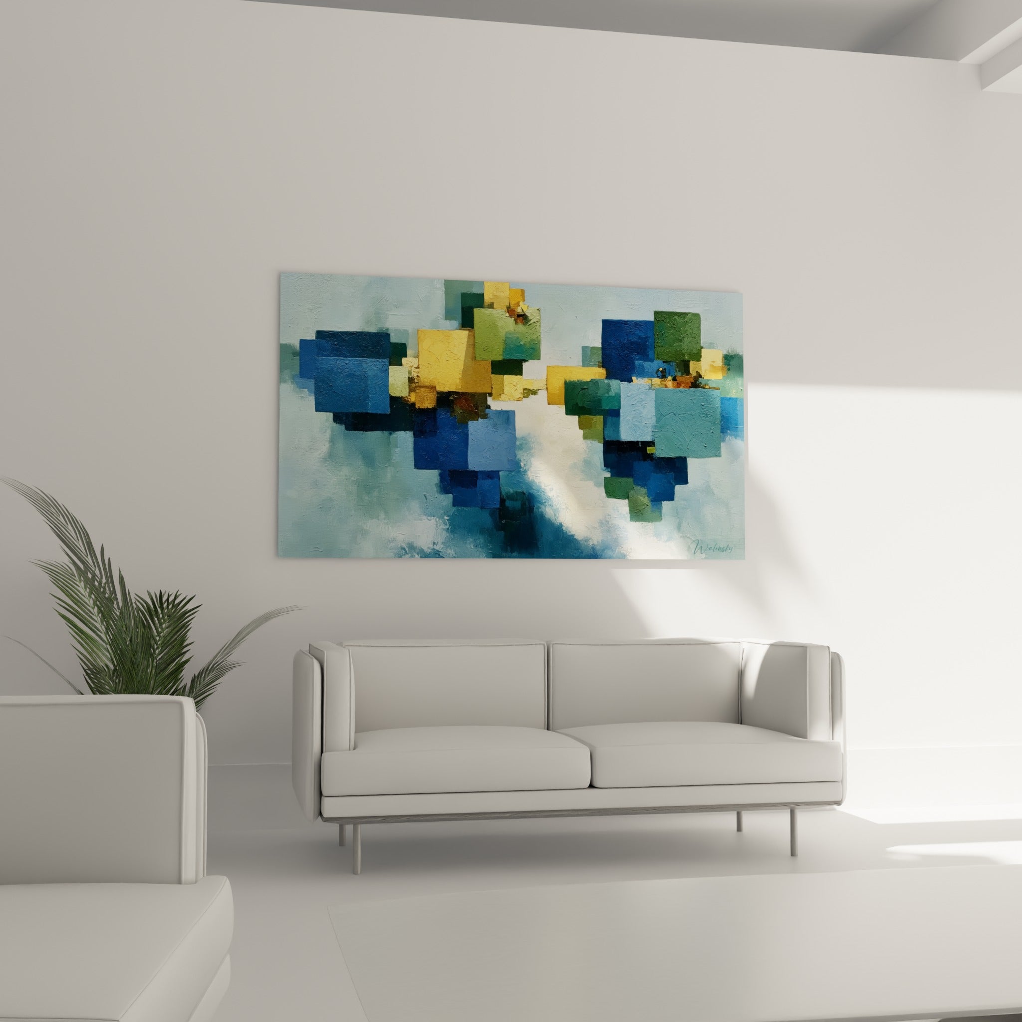 Carrés géométriques abstraits vert sauge et bleu marine disposés au-dessus d'un canapé dans un salon lumineux