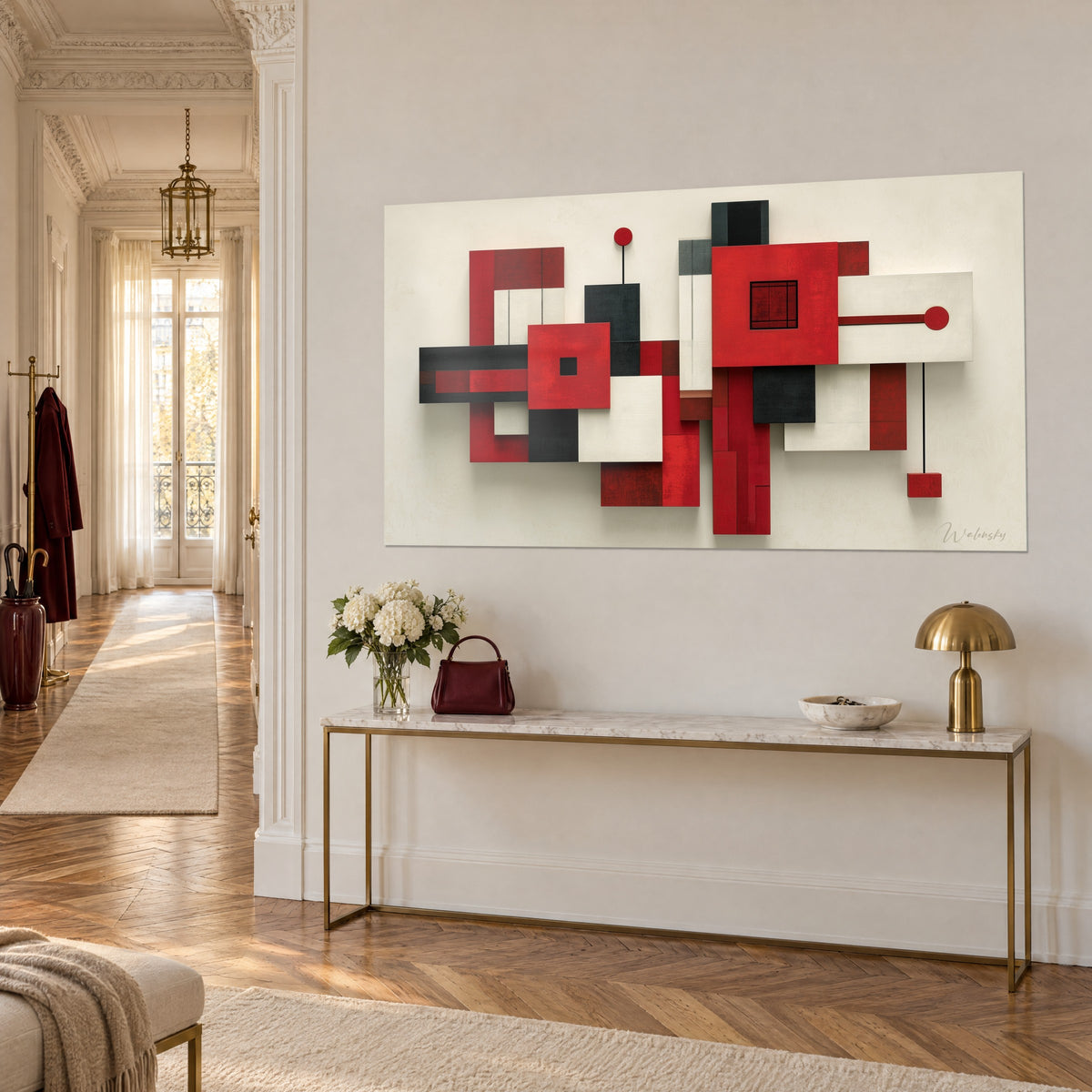 Quadro con architettura sospesa di rettangoli rossi, neri e avorio, quadrato centrale traforato, su una parete color crema, vista di tre quarti