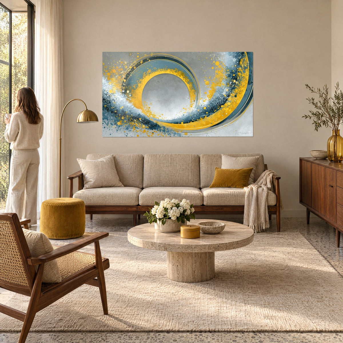 Wall art with a golden vortex and navy blue splashes, yellow spiral and pearl grey accents, above a sofa in a bright living room