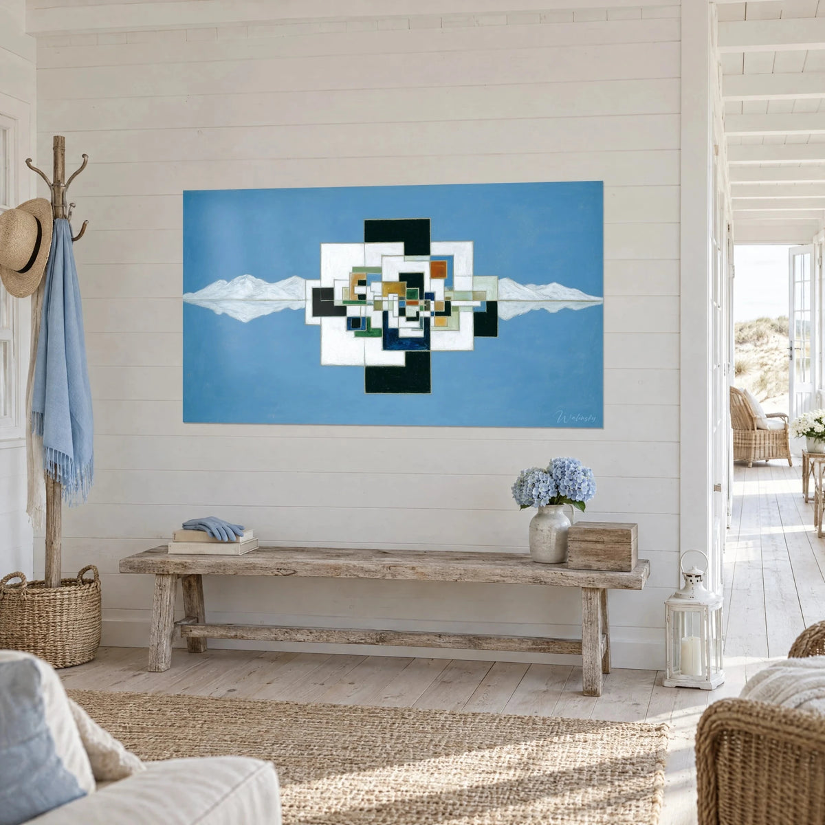 Wall art geometric prism with ochre and sage green squares, mirrored snowy mountains, white plank wall by the sea