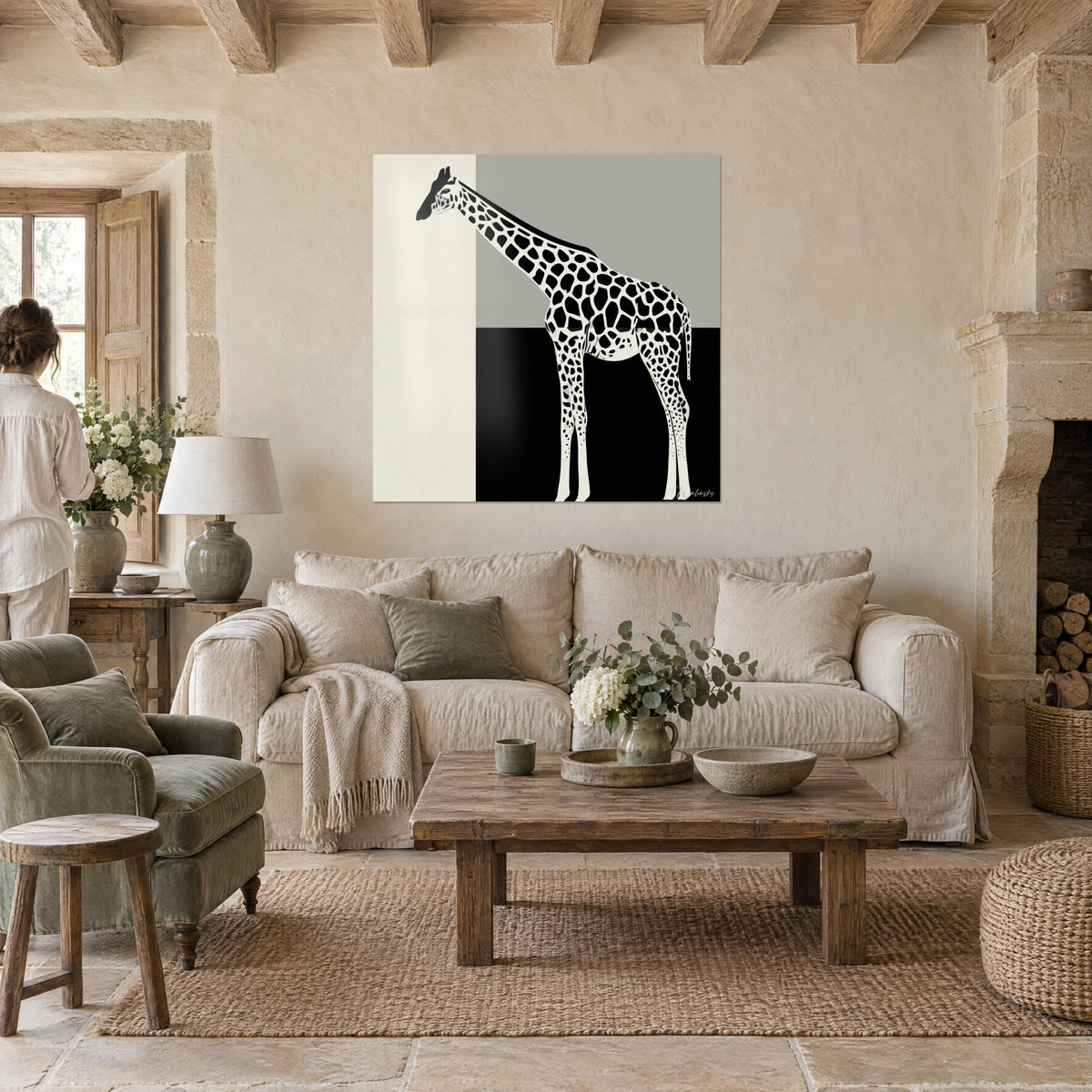 Wall art stylized giraffe in black spots on ivory and grey background, neck tilted, above a sofa in a bright living room