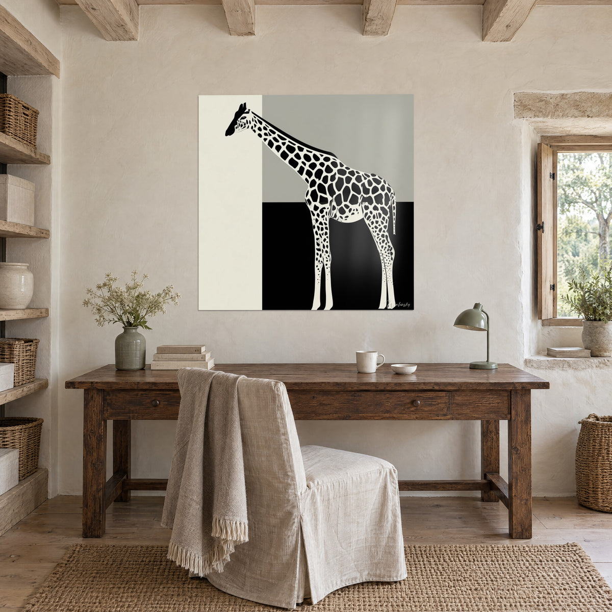 Wall art slender giraffe in flat tones of ivory, light grey and deep black, hung above a wooden desk near a window