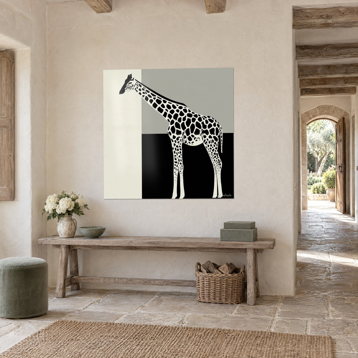 Wall art giraffe silhouette with black patterns cut out over three flat tones of ivory, pearl grey and black, in a stone entrance hall