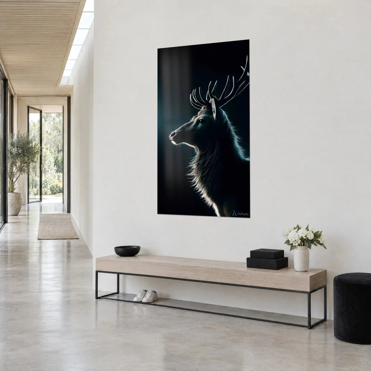 Wall art stag in profile with fine antler tines, outstretched muzzle, blue-green glow on black background, hung in a bright architect's hallway