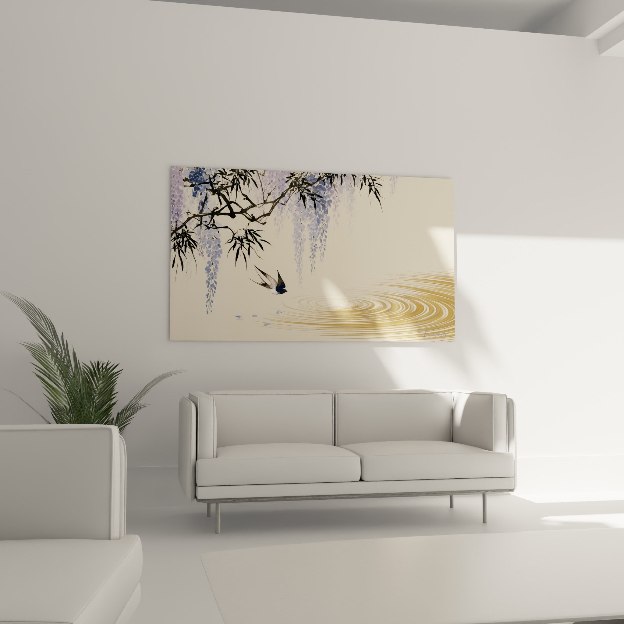 Branches anthracite et fleurs lilas de glycine au-dessus d'un canapé dans un salon lumineux