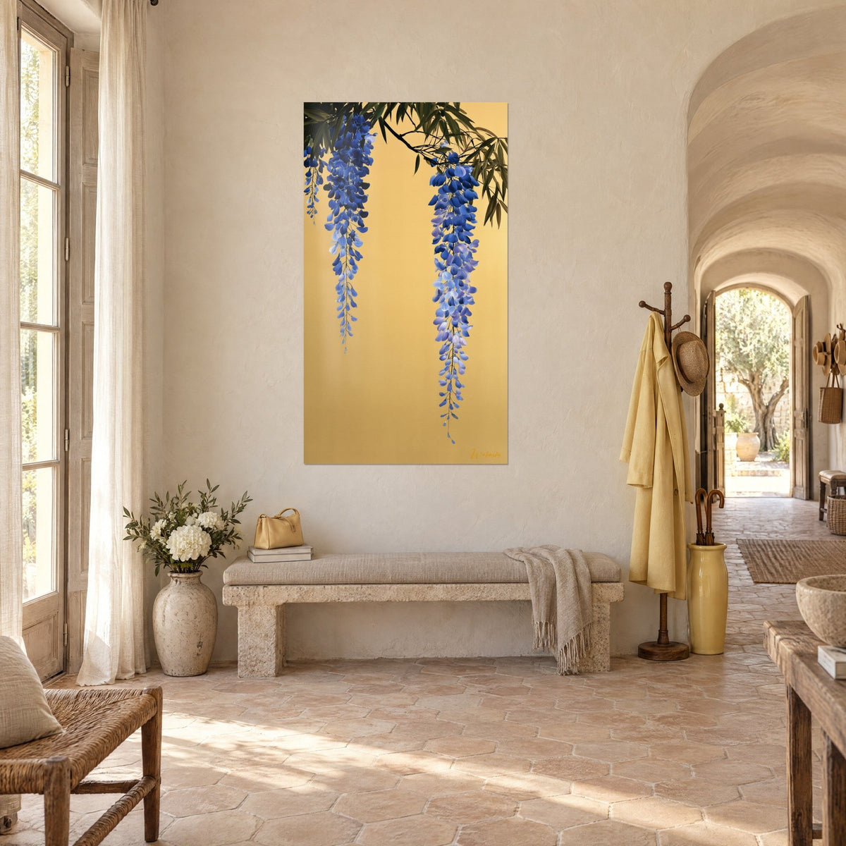 Wall art with drooping wisteria, indigo and lavender petals on gold, three-quarter view beside a stone bench in a vaulted corridor