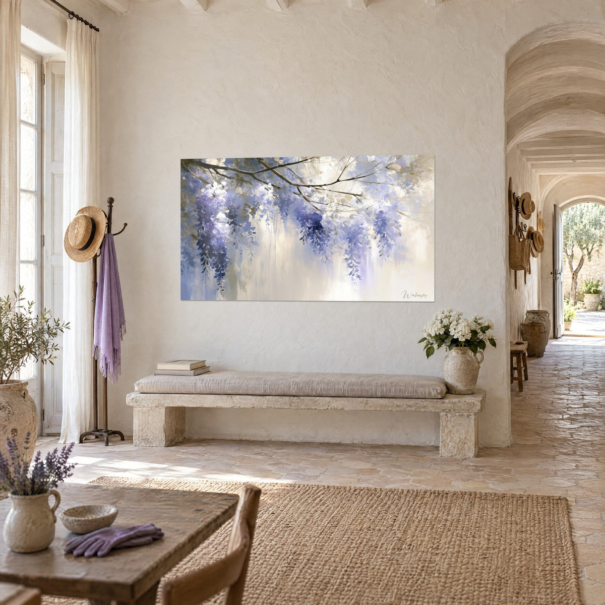 Wall art cascade of violet and midnight blue flowers on a veiled cream background, hung above a stone bench in the vaulted corridor of the farmhouse