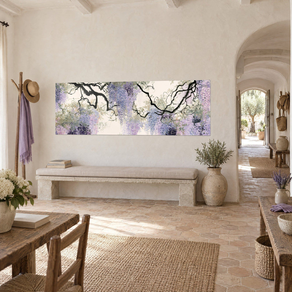 Wall art with twisting black branches laden with lilac and rosy wisteria clusters, cream background, stone bench, Provençal farmhouse in three-quarter view