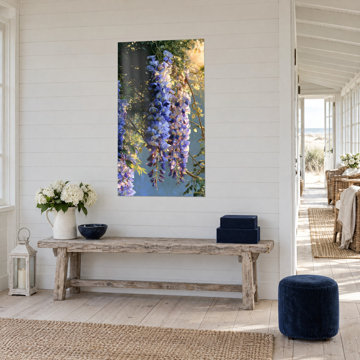 Wall art with hanging wisteria blooms, lavender petals and green foliage, three-quarter view, seaside house
