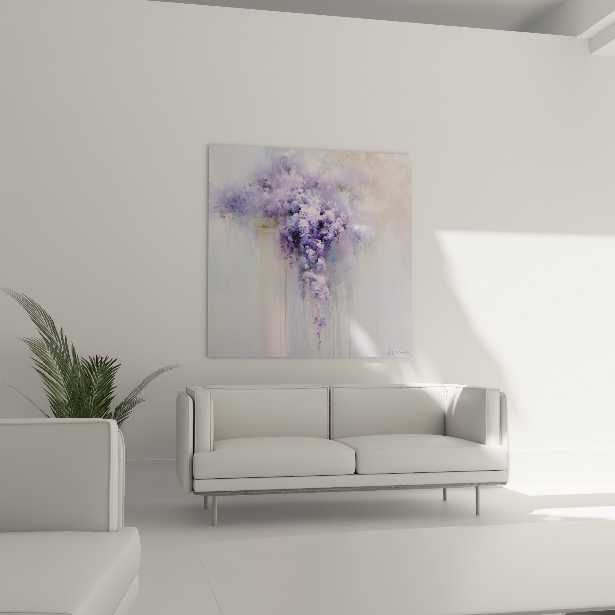 Fleurs de glycine lavande et ivoire suspendues au-dessus d'un canapé dans un salon lumineux