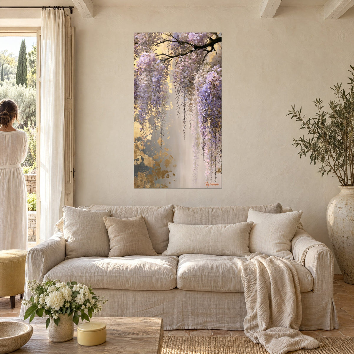 Wall art wisteria in lilac clusters cascading over a cracked gold background, cream wall, above a sofa in a bright living room