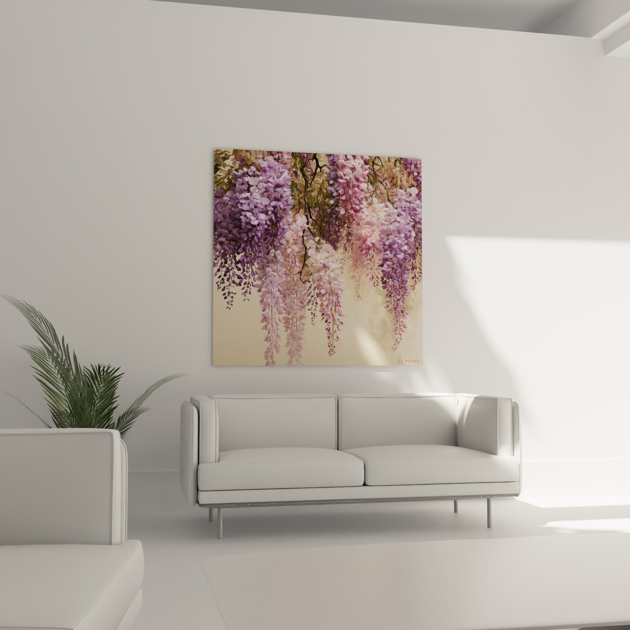 Branches fleuries de glycine lilas et rose pâle, disposées au-dessus d'un canapé dans un salon lumineux