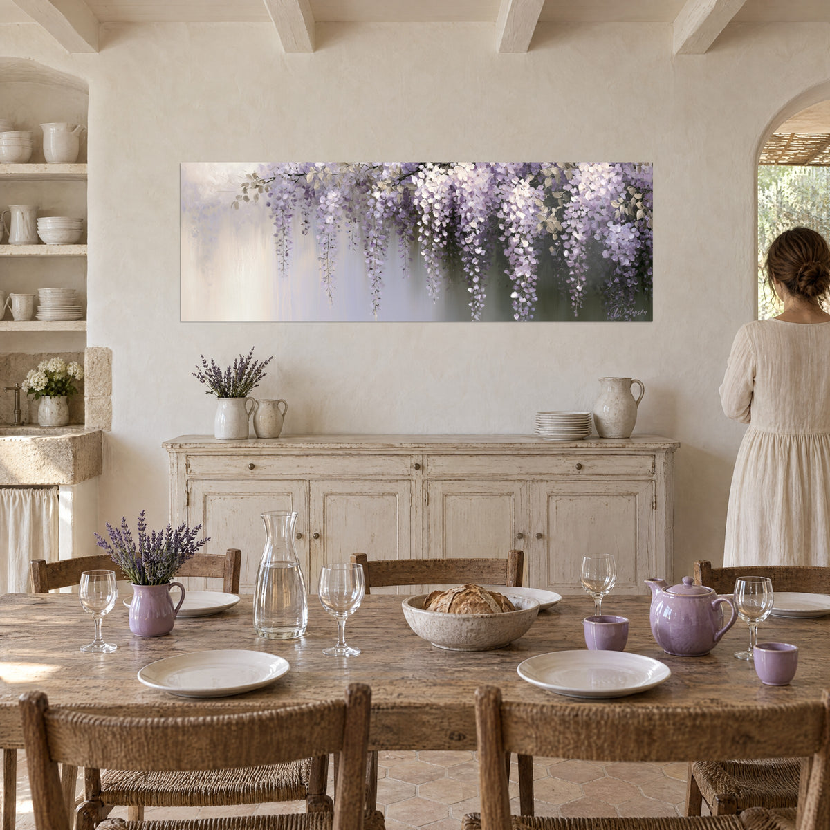 Wall art shower of parma-violet and white petals on a greyed background, a woman in a light dress seen from behind beside a set table